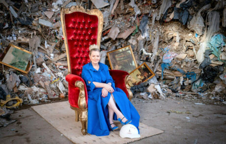 Jacqueline O'Donovan sitting on a crown, thrown and waste behind her with helmet at feet